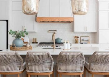 The kitchen renovation plan is a bright and airy open floor plan with great potential, including a new freestanding island, bar seating and updated appliances.