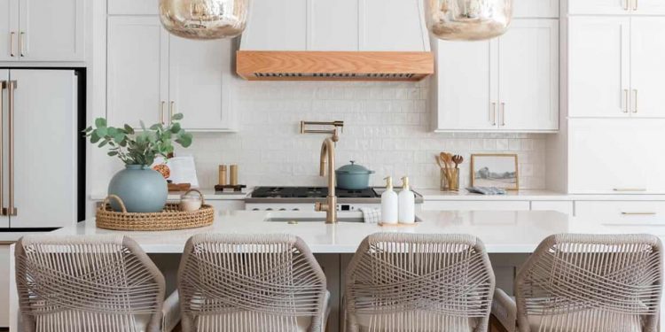 The kitchen renovation plan is a bright and airy open floor plan with great potential, including a new freestanding island, bar seating and updated appliances.